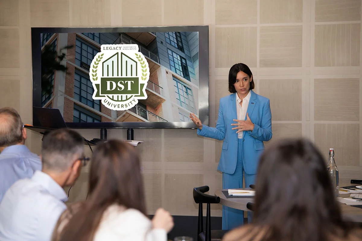Jamie Furlong presenting DST University, a Delaware Statutory Trust training course for realtors, to a room of people