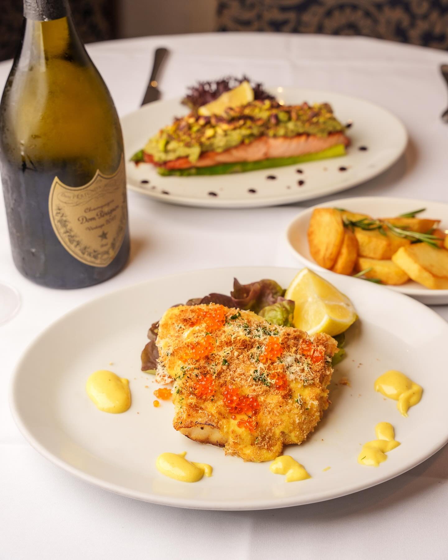 When the day&rsquo;s catch lands in our kitchen, creativity takes over. Our chefs craft dishes like this golden-crusted masterpiece &mdash; topped with delicate roe and finished with a saffron aioli &mdash; inspired by what&rsquo;s freshest from sea 