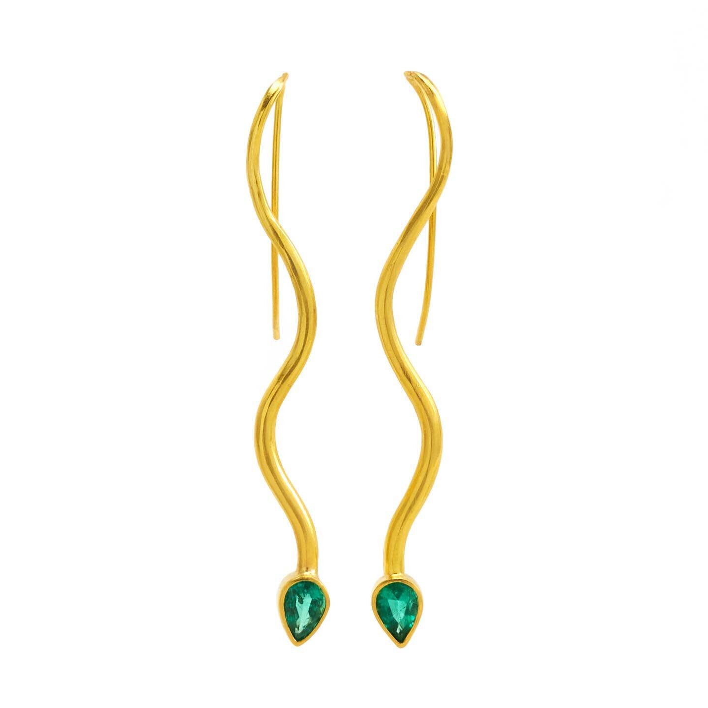 The undulating curves and glowing emerald heads make these the kind of snakes you want hanging around. 
Snakes are known as a symbol of rebirth, transformation and continuous renewal. Emeralds pair beautifully with this as they are known for stimulat