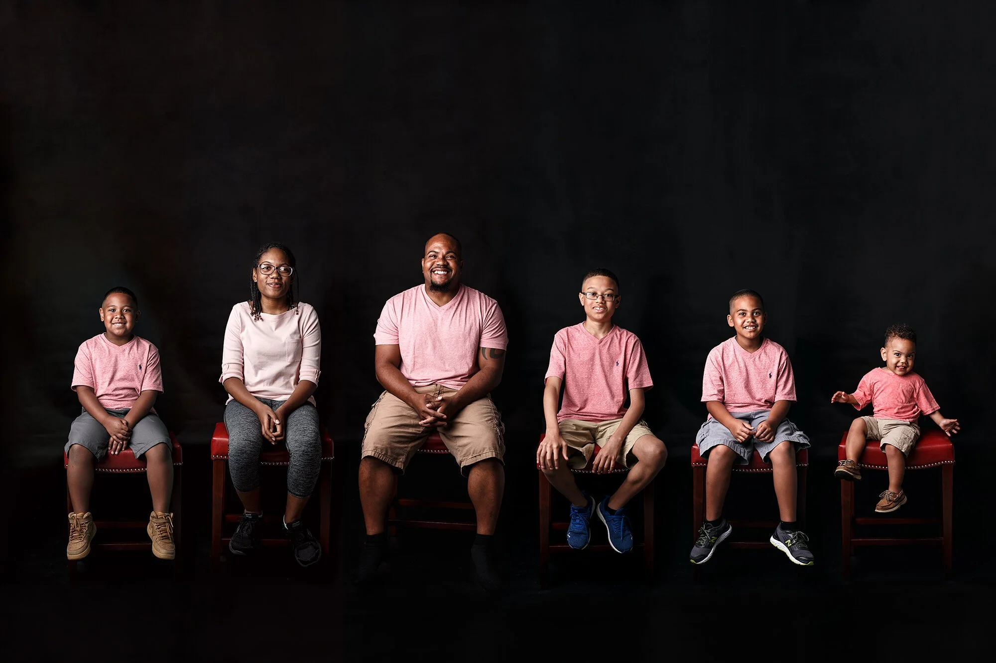 Composite photo of dad with his five children on black background by Laurel, MT photographer
