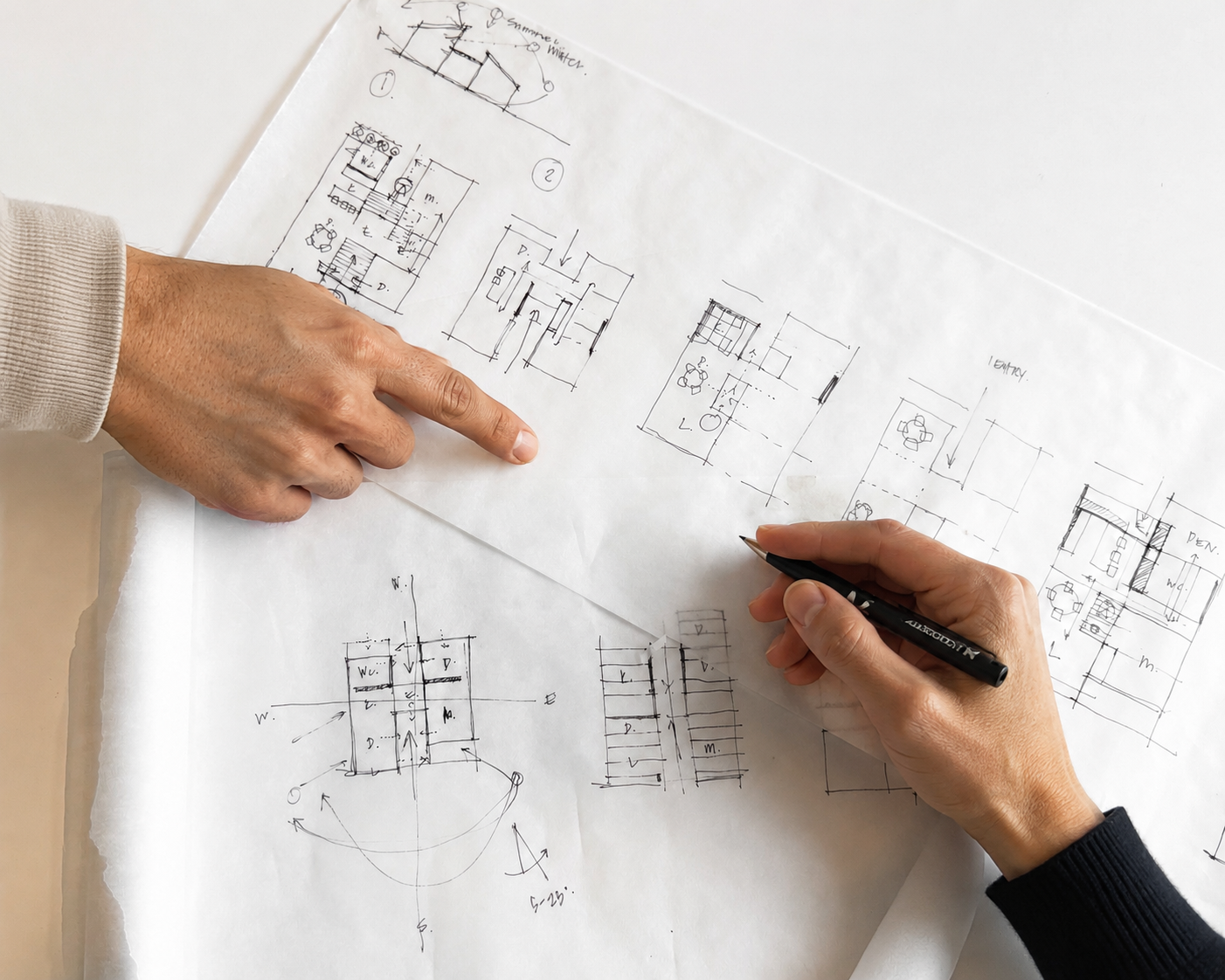 Architectural floor plan and elevations of a small bathroom, showing toilet, sink, and door layout.