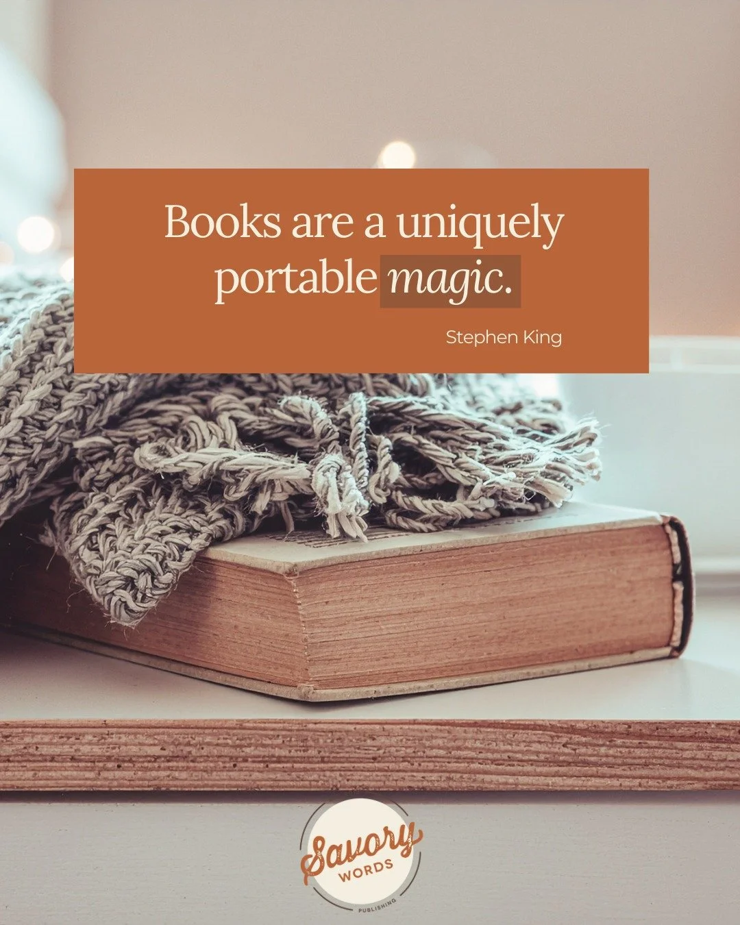 Truer words were never spoken (written).

ID: A photo of a thick blanket atop a hardcover book and pages is shown. At top in a rust-colored box is white text: "Books are a uniquely portable magic. Stephen King." At bottom center is the SW l