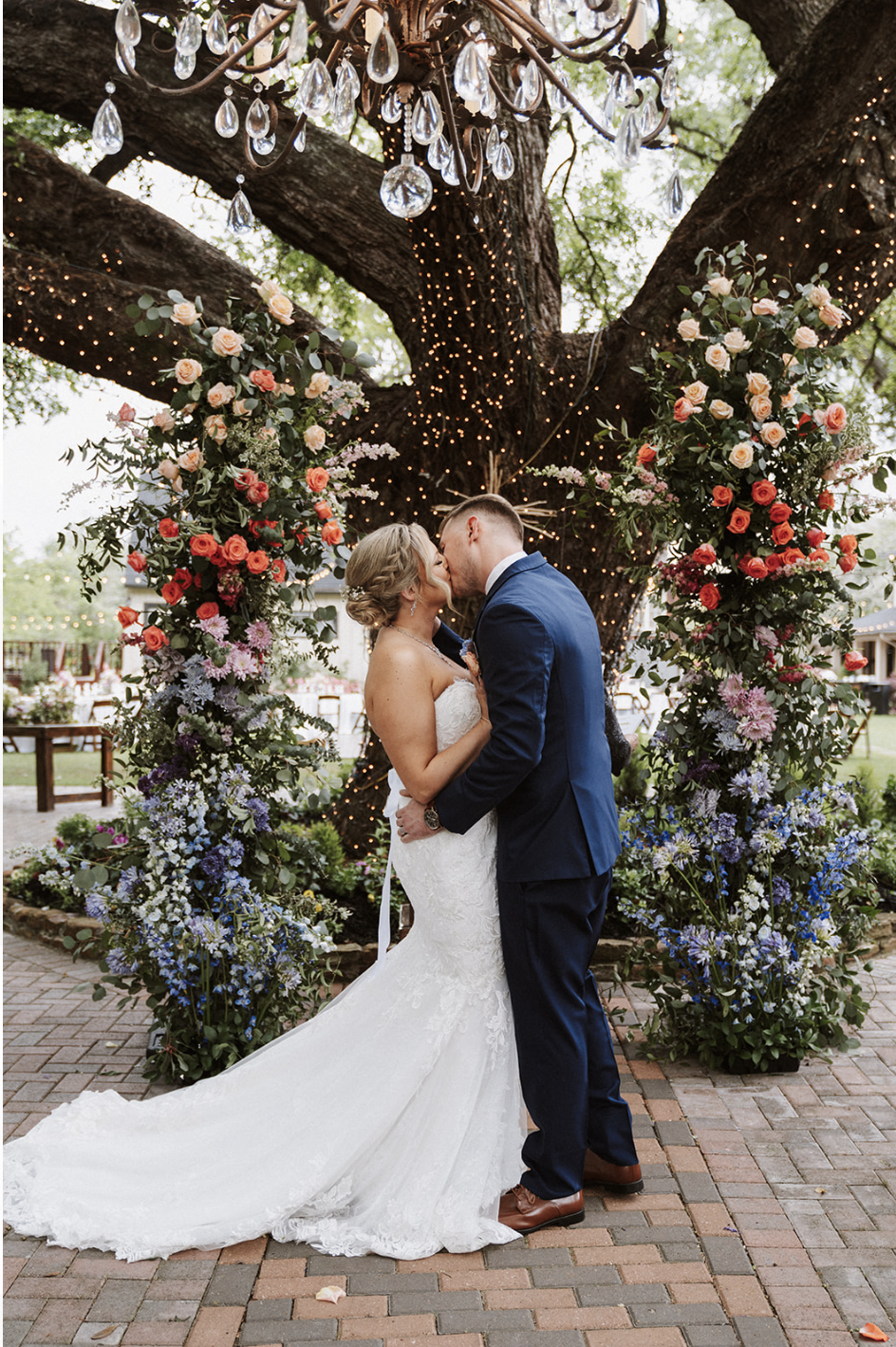 Broken arch with a couple standing in front.