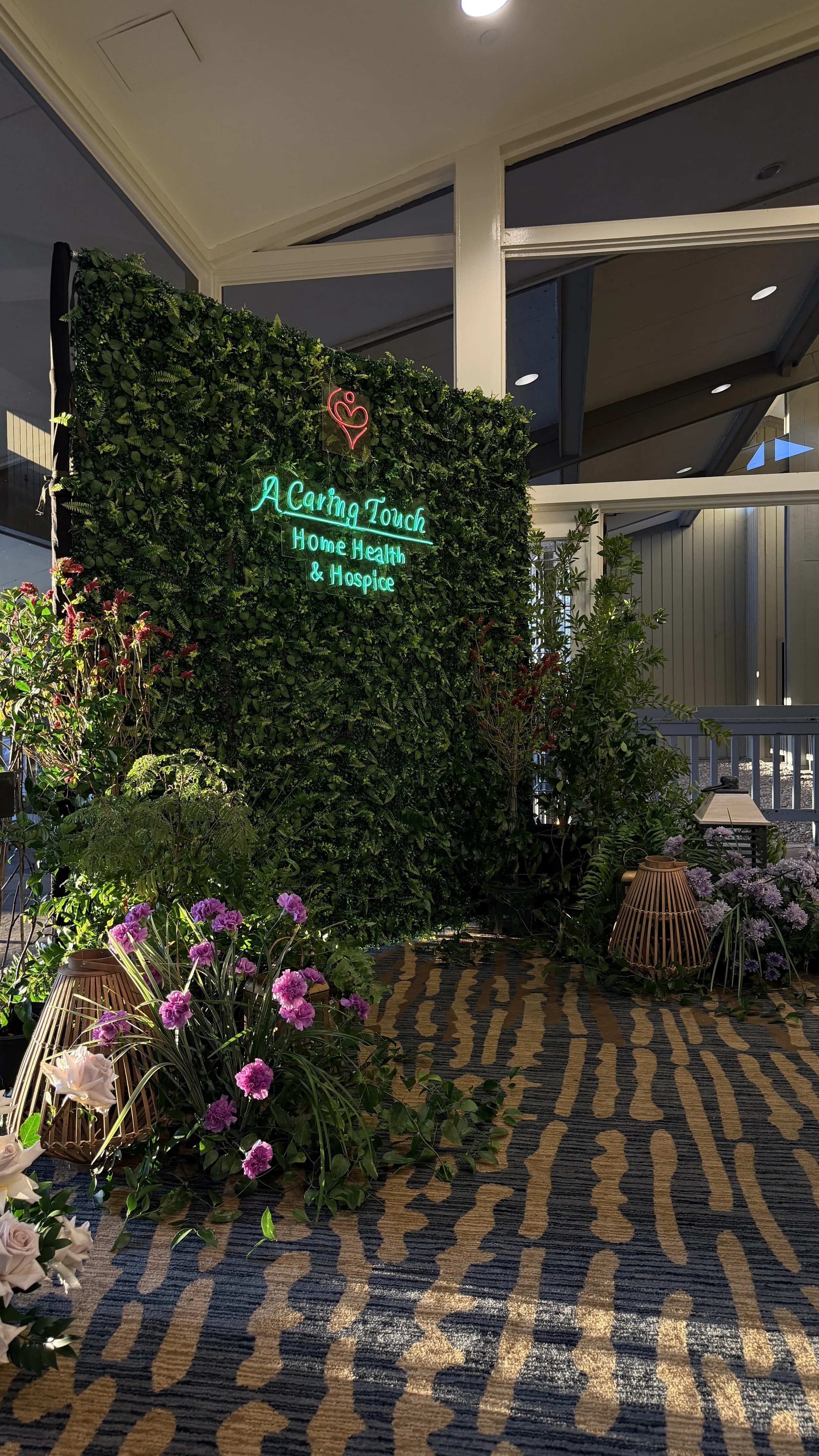 Refined holiday floral styling for a corporate event, designed to create a festive yet polished atmosphere for guests.