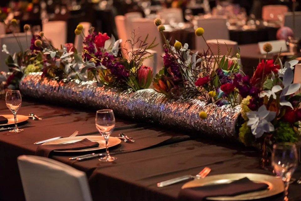 Large-scale floral installations designed for a formal gala, showcasing elevated corporate floral design in a high-visibility setting