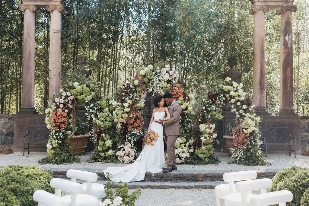 Floral arch with pastel flowers.
