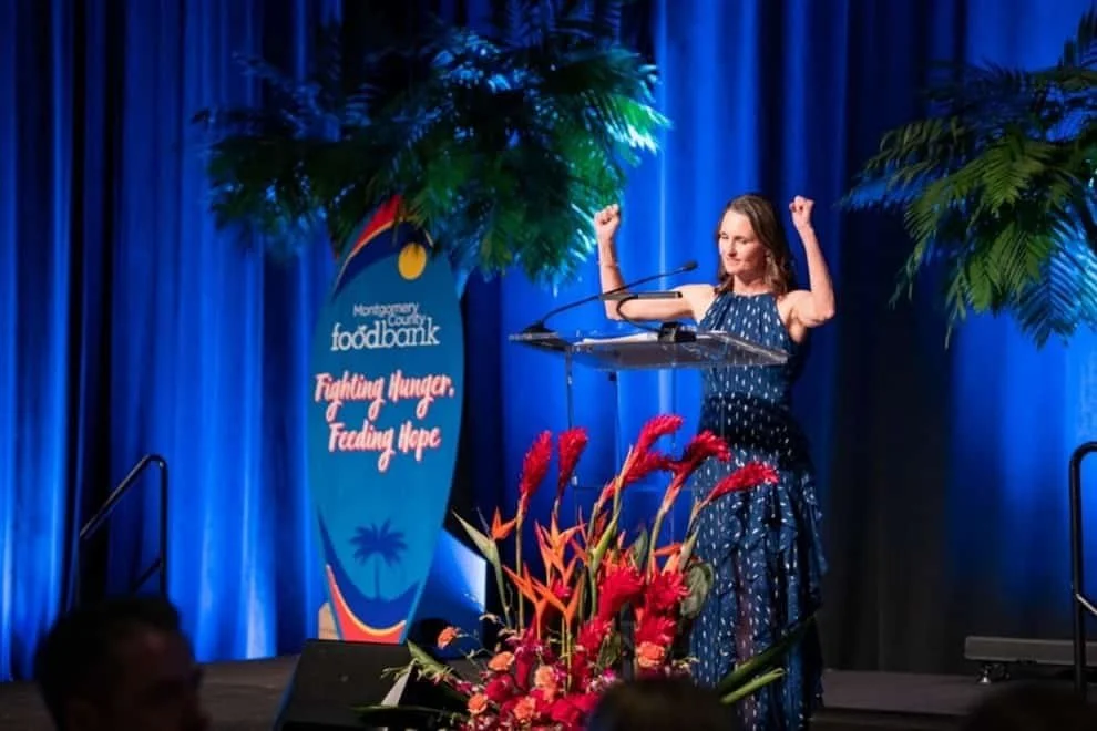 MoCo Food Bank Gala stage with arrangement by Fashionable Florist.