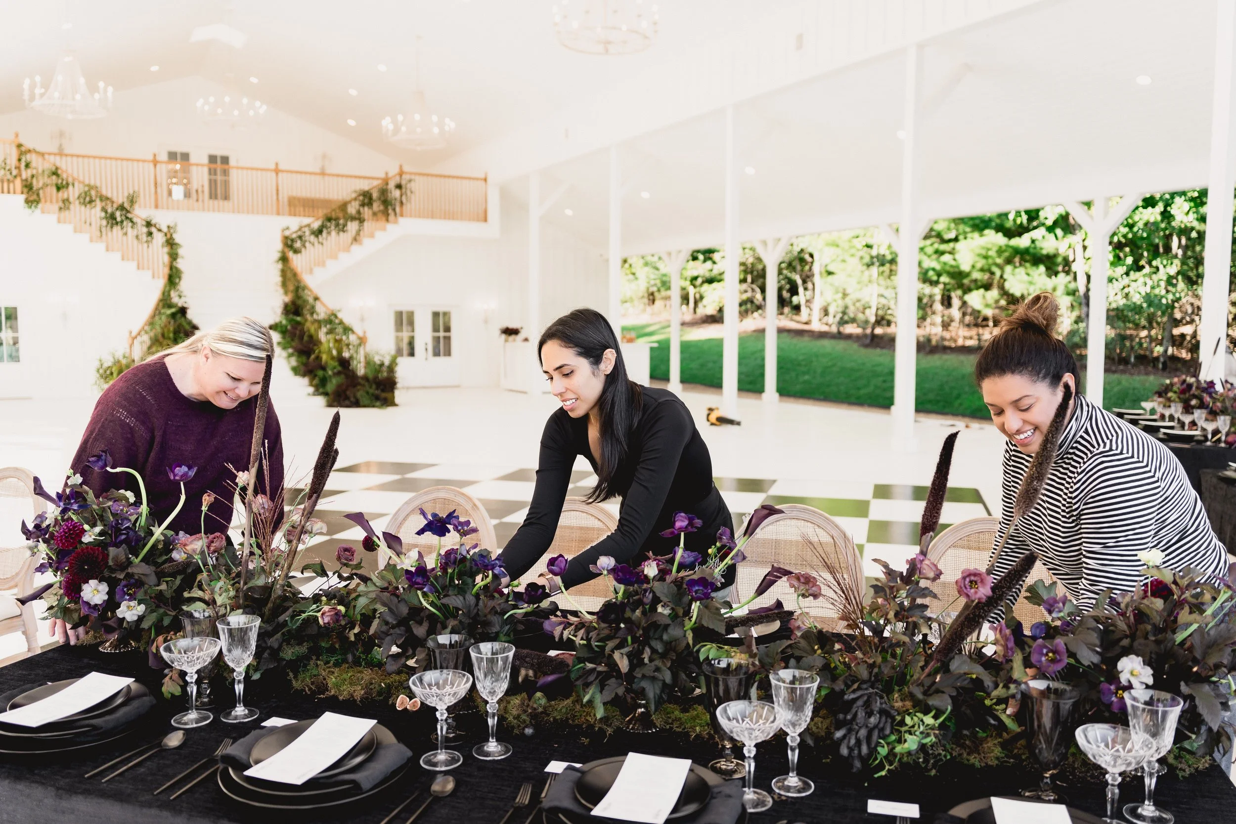Fashionable Florist working on a tablescape.