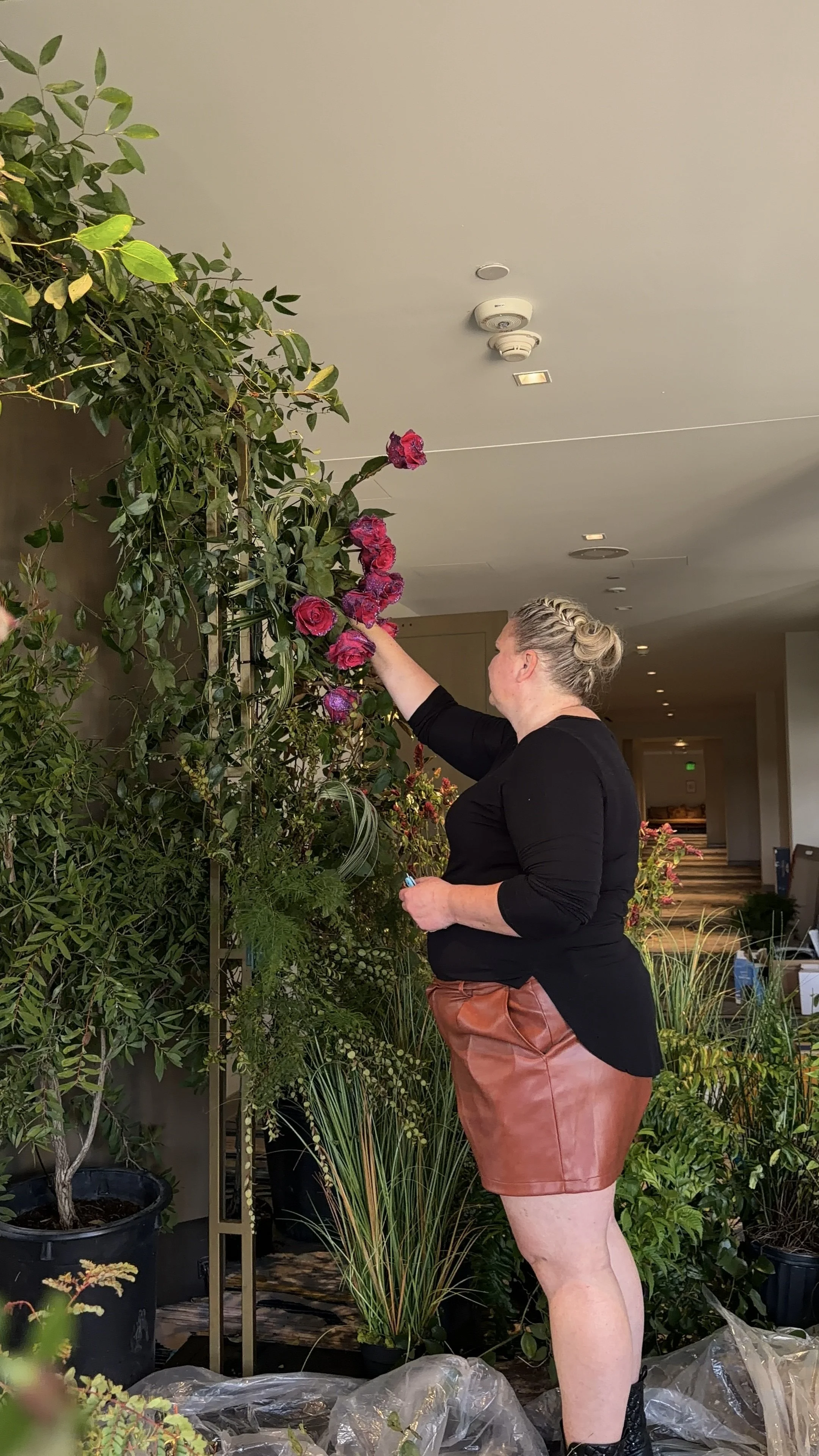 Fashionable Florist designing an enchanted garden