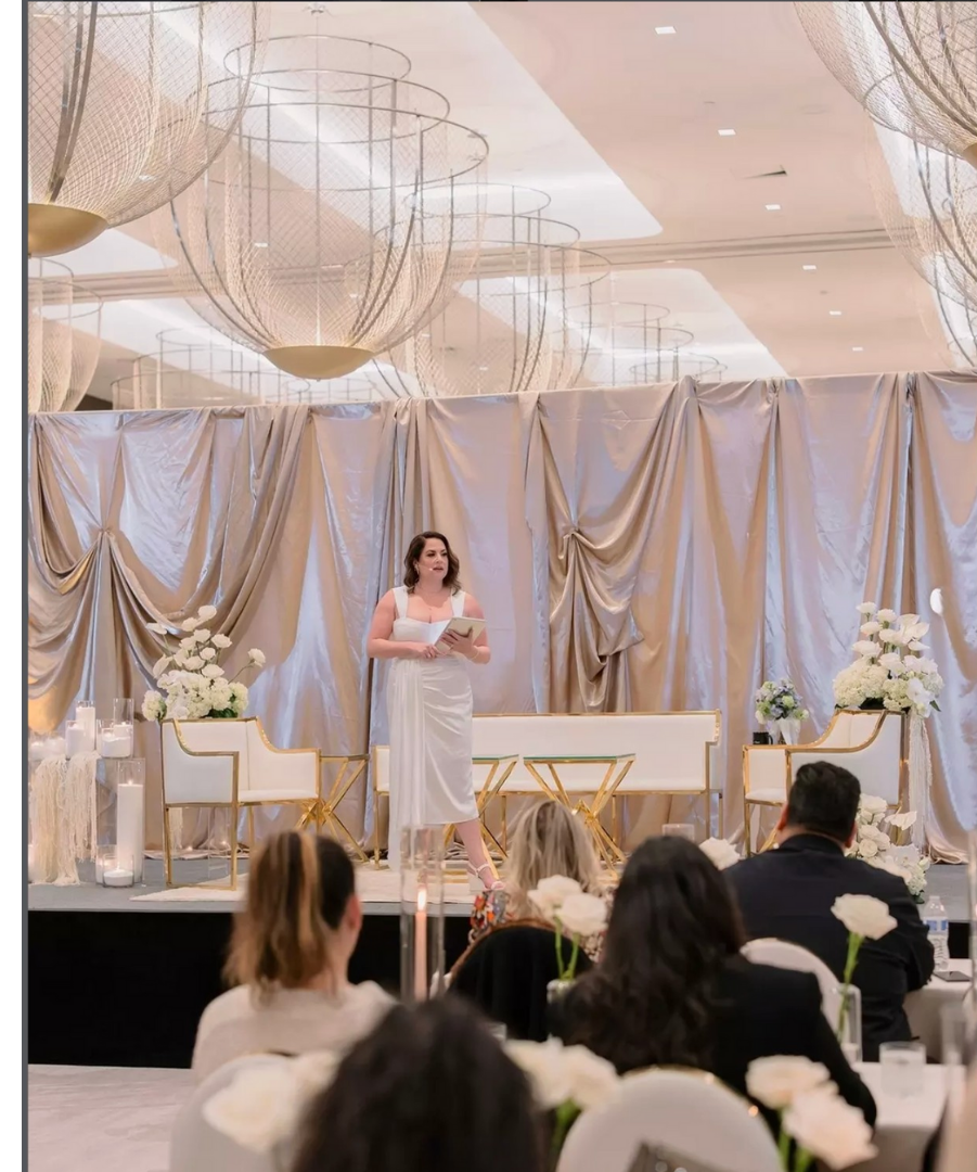 Floral design framing a speaker engagement at a corporate event, creating a polished backdrop for panels and presentations.