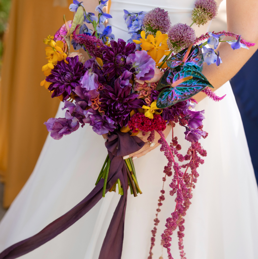 A rich colored bridaly bouquet designed by Houston luxury florist, Fashionable Florist.