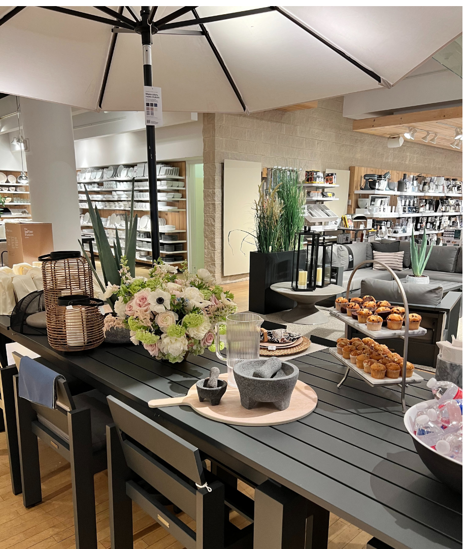 Branded floral design for a Crate & Barrel corporate event, featuring modern arrangements styled to reflect the brand’s aesthetic and retail environment.