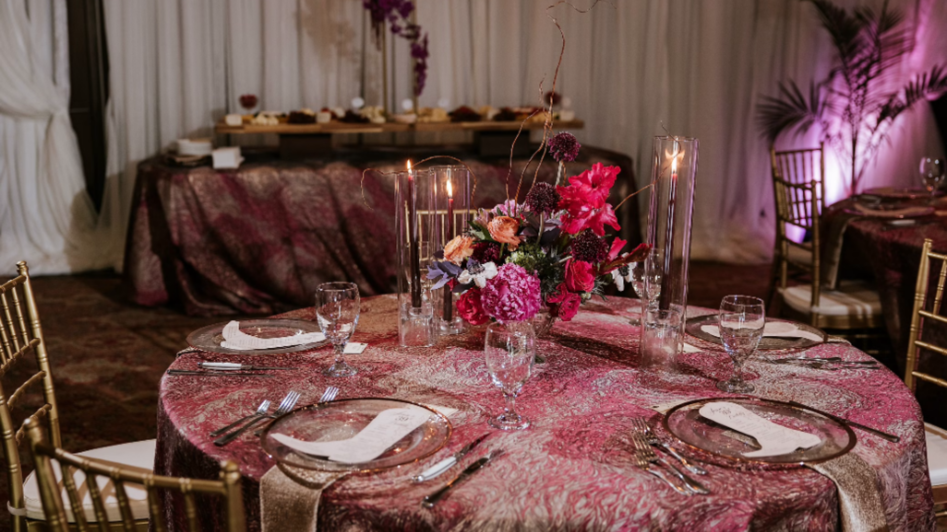 A tablescape with florals in a variety of pinks.