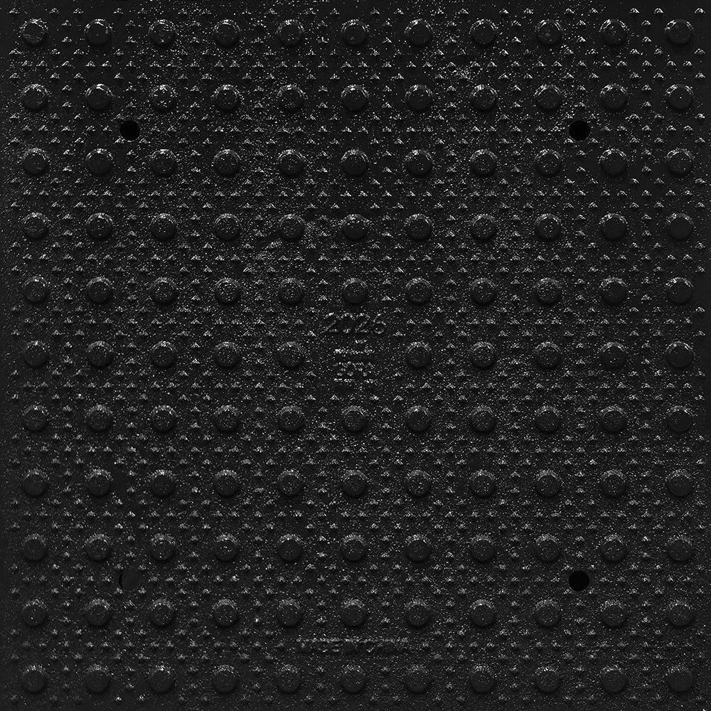 Product close-up of the GORA 24x24" (610x610mm) onyx black steel tactile plate.