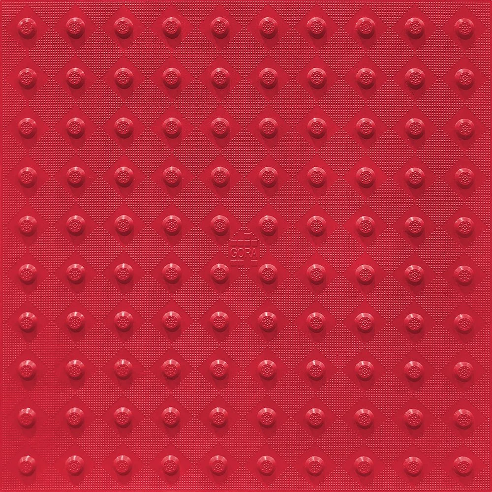 Product close-up of the GORA 24x24" (610x610mm) brick red fiberglass tactile plate.