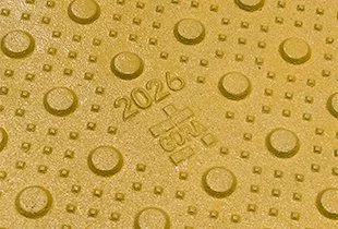 Close-up of the GORA 24x24" safety yellow steel tactile plate.