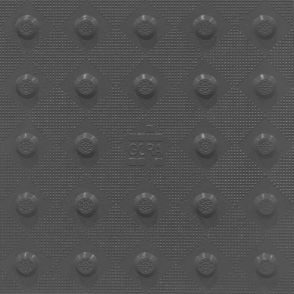 Product close-up of the GORA 12x12" (305x305mm) dark grey fiberglass tactile plate.