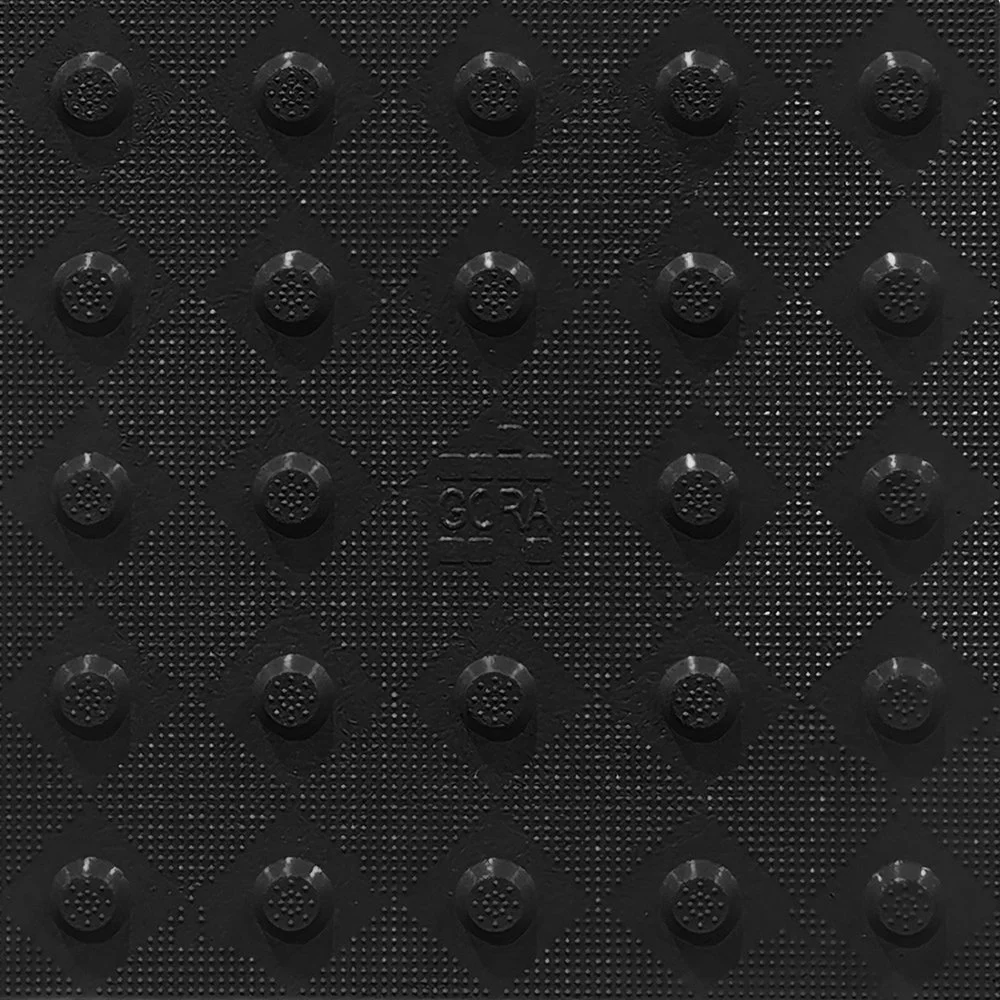Product close-up of the GORA 12x12" (305x305mm) onyx black fiberglass tactile plate.
