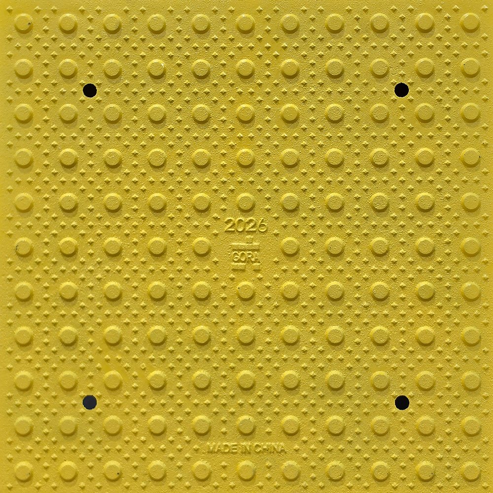 Product close-up of the GORA 24x24" (610x610mm) safety yellow steel tactile plate.