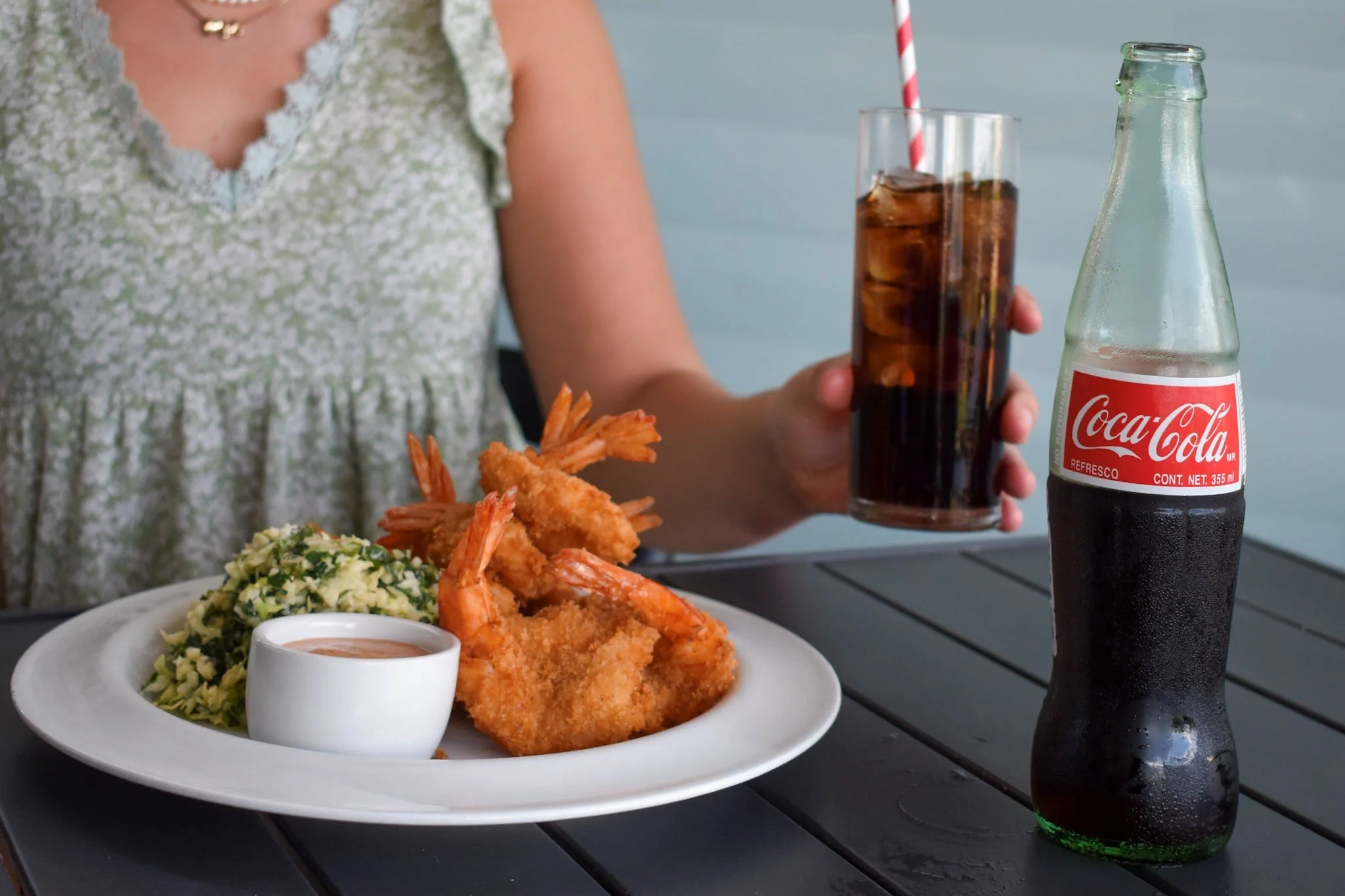 hand battered Jumbo fried shrimp. house made cole slaw. cabbage and kale cole slaw. bottled cokes. crisp refreshing mexican cokes. unique remoulade dipping sauce. fresh sea food options. outdoor fans and misters. Large TV. Game day. Aggie football