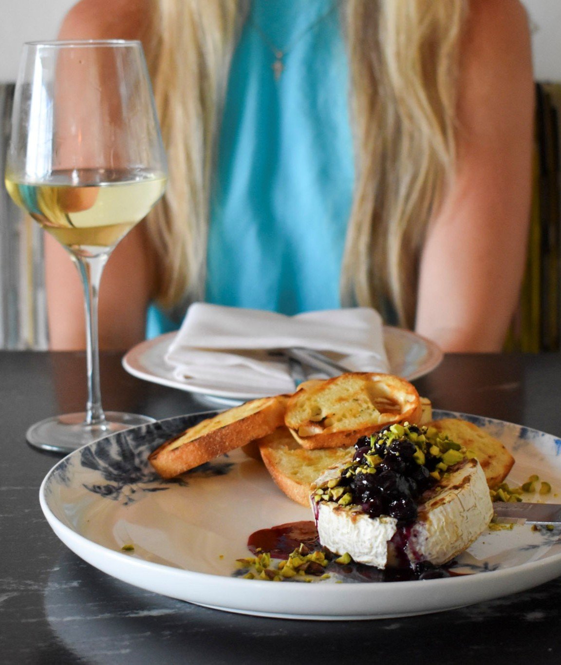grilled brie with seasonal fruit compote. Grilled french bread. wine night. cocktails with girlfriends. girls night out. great spot for sorority girls and college students. greek life hang out spot. affordable options. gluten substitutions.