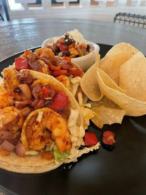 Today's special taco. Shrimp and Grits. Fresh pico. Sauteed Shrimp. Cheddar Grits. Cowboy Caviar. daily specials.
