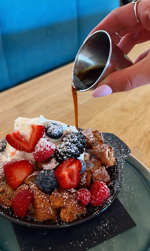 The best brunch near me. Frenchie is a croissant casserole with fresh fruit and berries, house made whipped cream, and maple syrup. Weekend brunch specials. college station breakfast spot. great after church brunch location. sweet tooth.