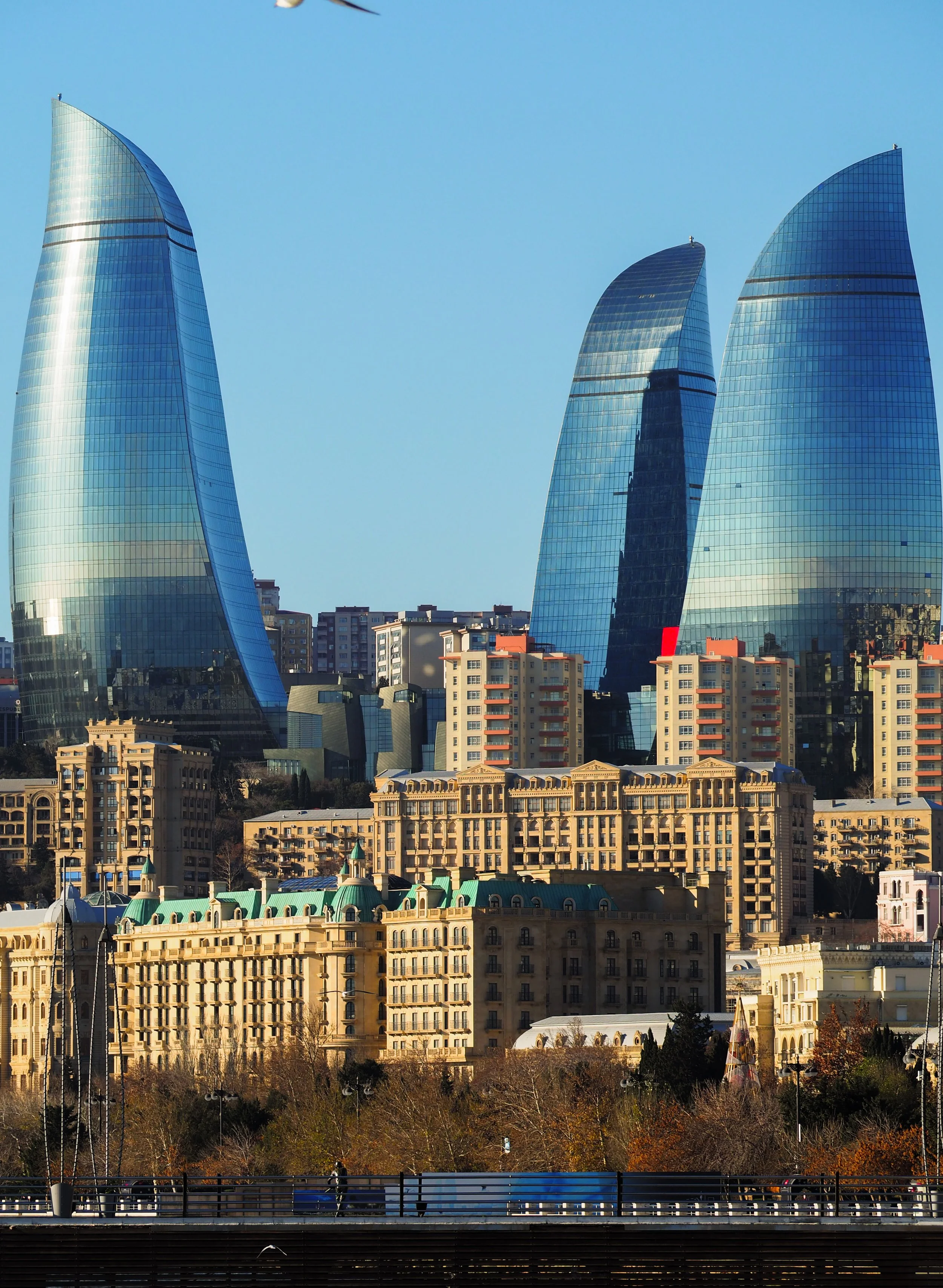 Skyline of Baku with Flame Towers and traditional buildings
