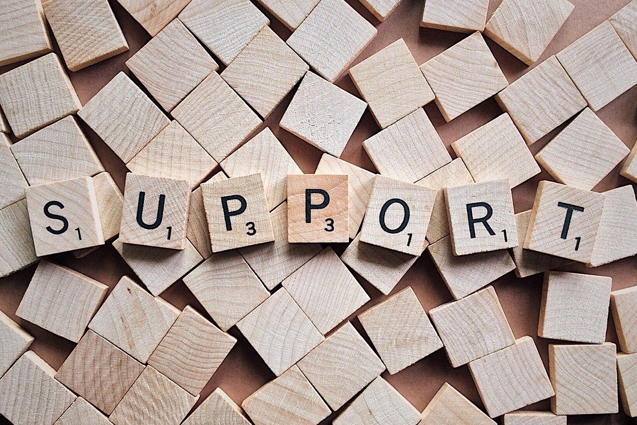Scrabble tiles spelling out the word 'support'