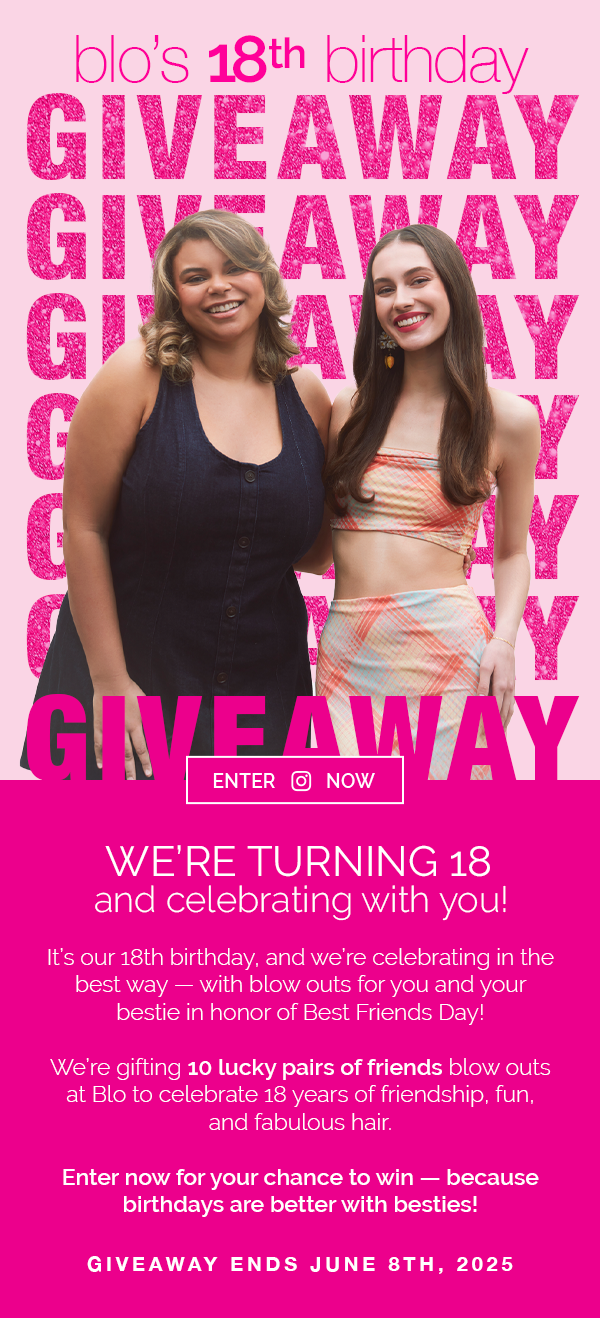 Two young women smiling at a birthday giveaway event with a pink background. One woman has wavy blonde hair, wearing a dark sleeveless top, and the other has long brown hair, wearing a pastel-colored plaid crop top and skirt.