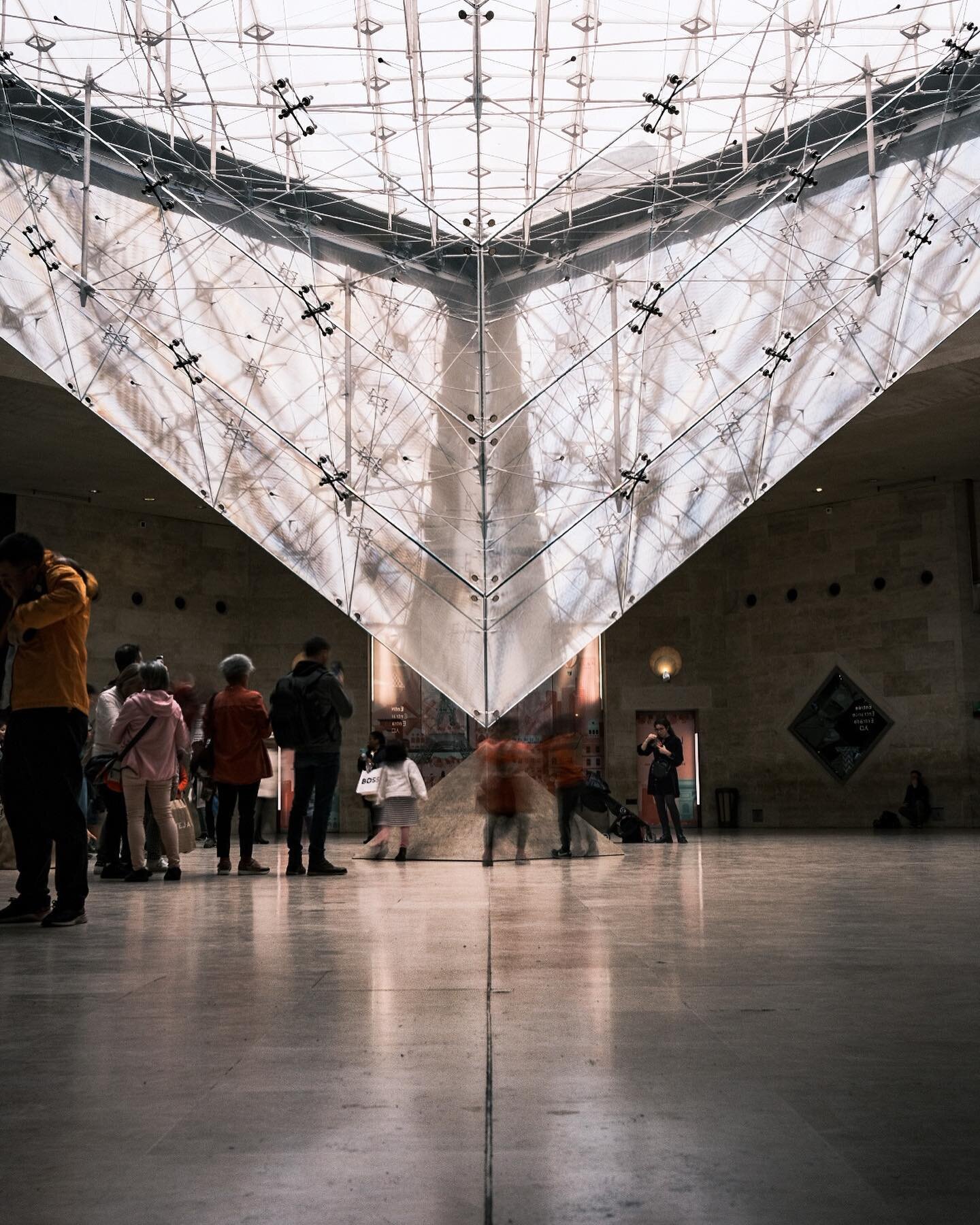 The Louvre is impressive in person. This upside down pyramid is part of 3 larger pyramids that are above ground. I will say this place was extremely crowded with kids jumping on the center stone. I lowered the shutter speed to 1 second here and the k