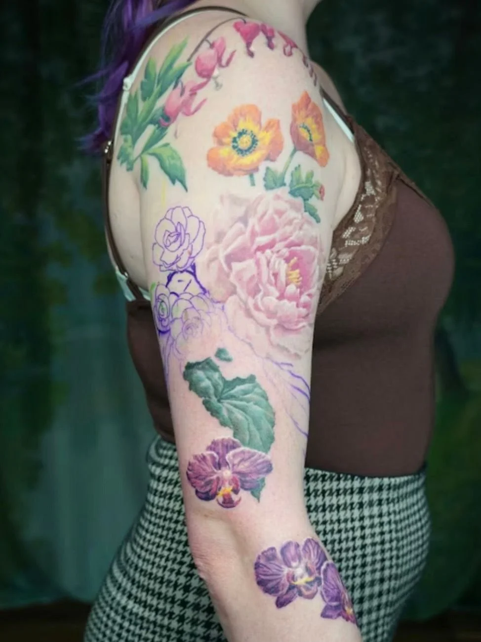 She came back and so did you! Here is where we are now.👇🏼

The orchids are the newest addition and they are still fresh here, which is why they read more intensely than the healed work on her upper arm. That contrast will soften over time as everyt