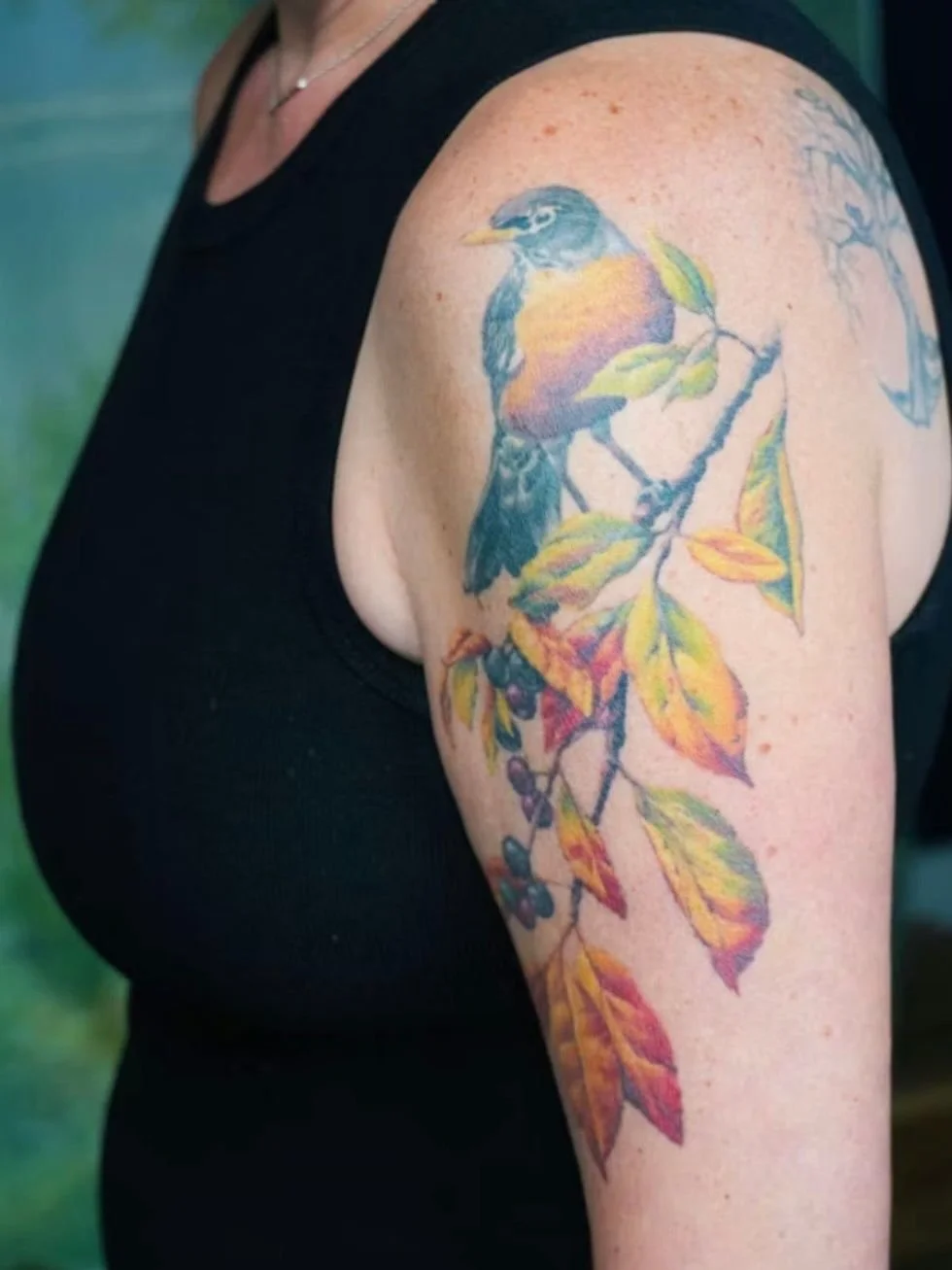 Four years later she came back. Not to change it. Just to love it a little longer.

Becki got this robin for her mom Robin. The fall crabapple branch was intentional because it let the yellows and oranges of the bird carry all the way down through th