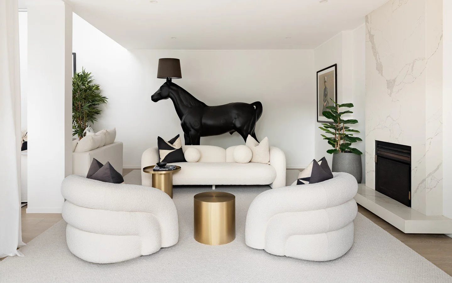 A seriously sophisticated space with an extra twist of whimsey and madness. I'm looking at you @Moooi Horse Lamp. ⁠
Visible across two connecting living spaces, there is no hiding this black beauty, but instead you shine a light on it. 💡 | St Helier