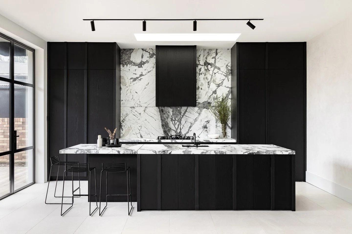 Some kitchens whisper. This one by @at.space_nz knows exactly how to speak volumes. 
There's a restraint here that takes real confidence - every element earning its place, nothing competing for attention it hasn't been given. 

When a material this d