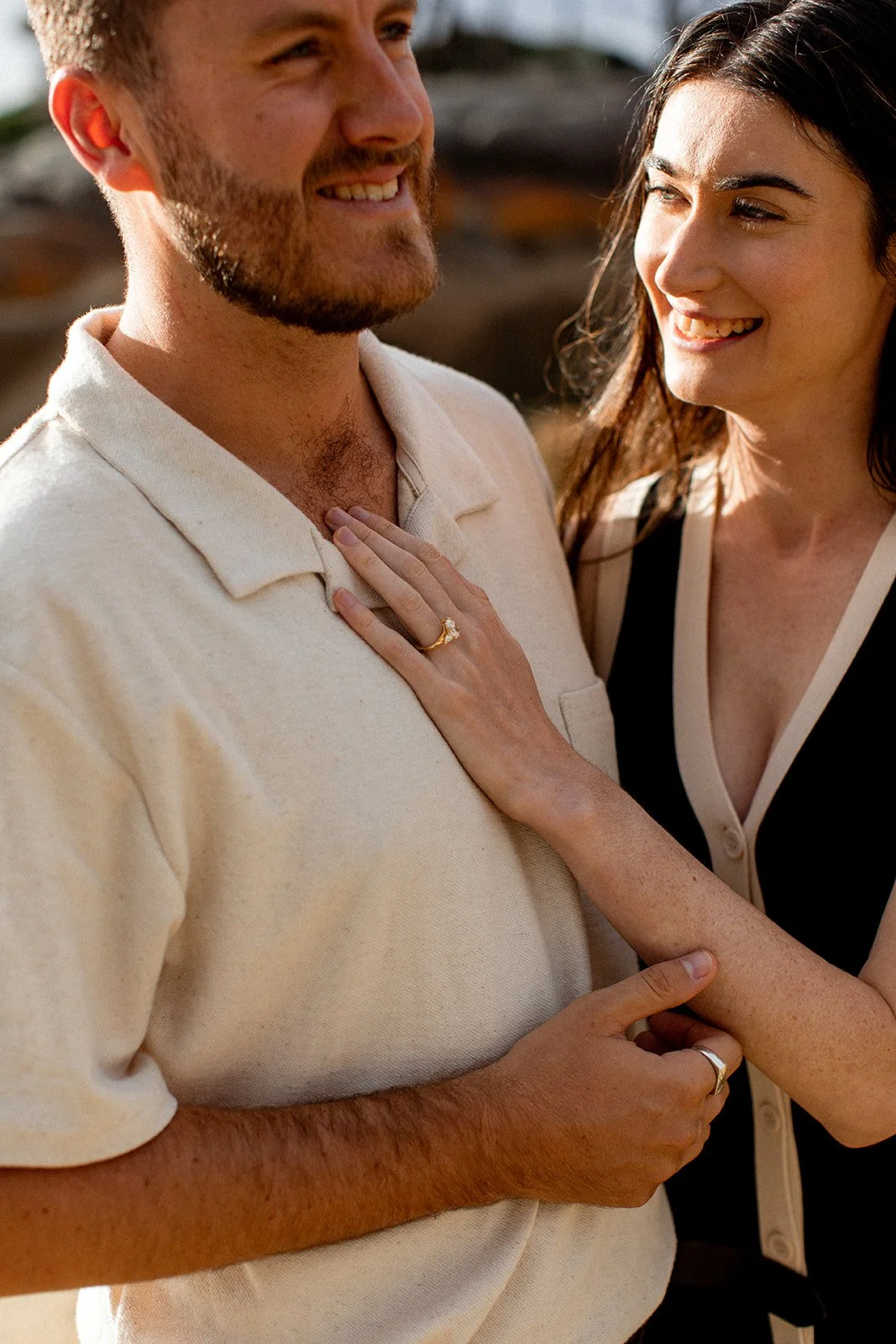 Couple showing engagement ring