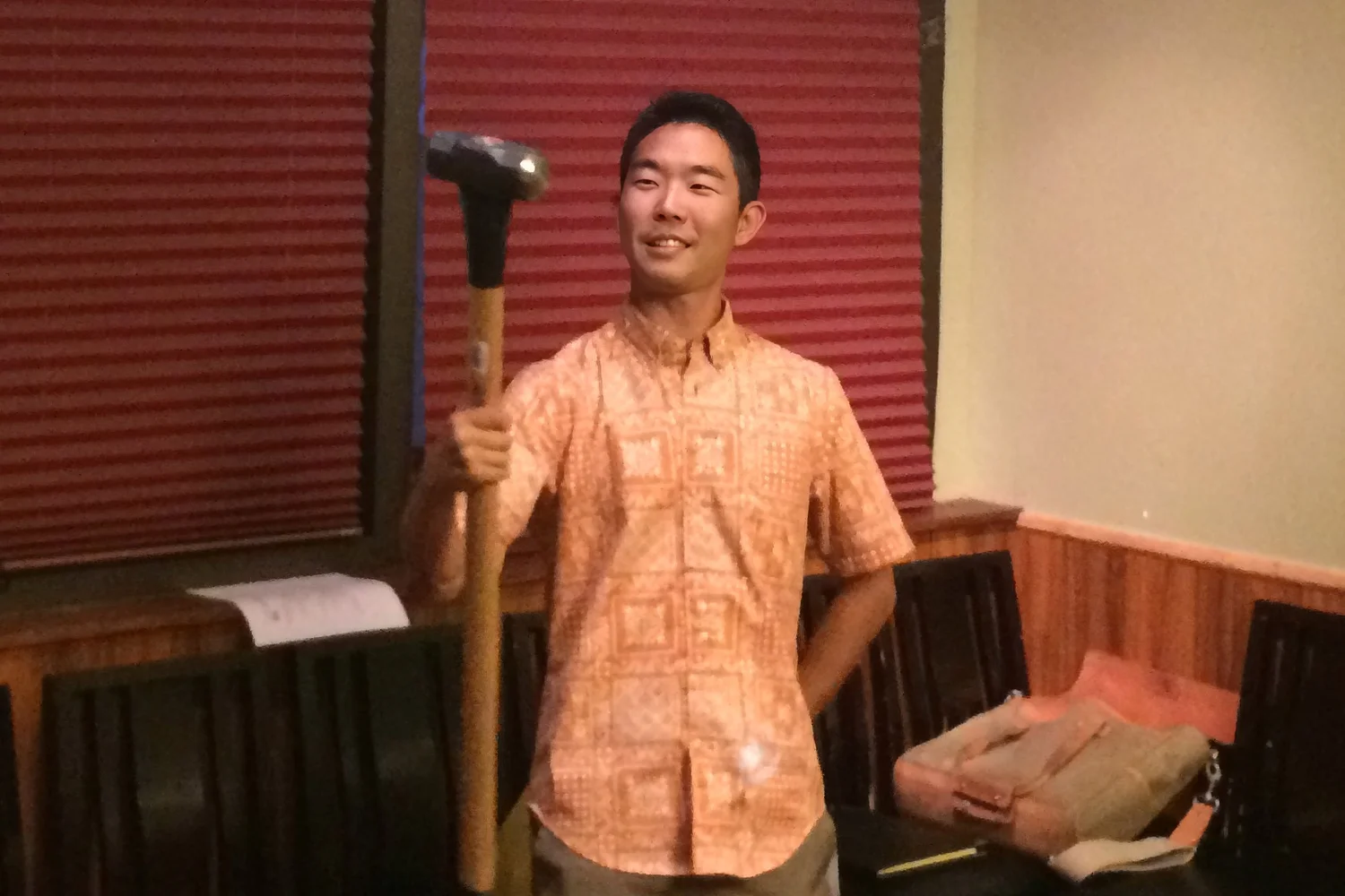 JCI Senator Tyler Hiranaka using a sledgehammer as his gavel at the February 2015 Asian American Jaycees General Membership Meeting.