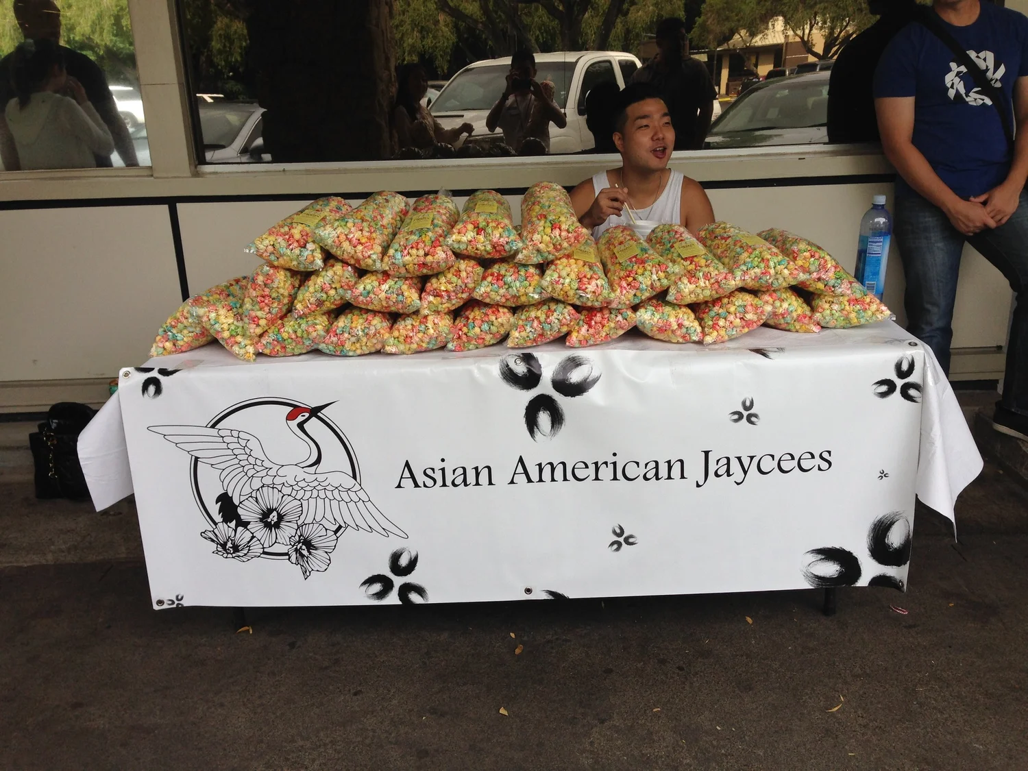 Asian American Jaycees member Maxs Yoon working the chapter’s kettle corn fundraiser table in February 2015.