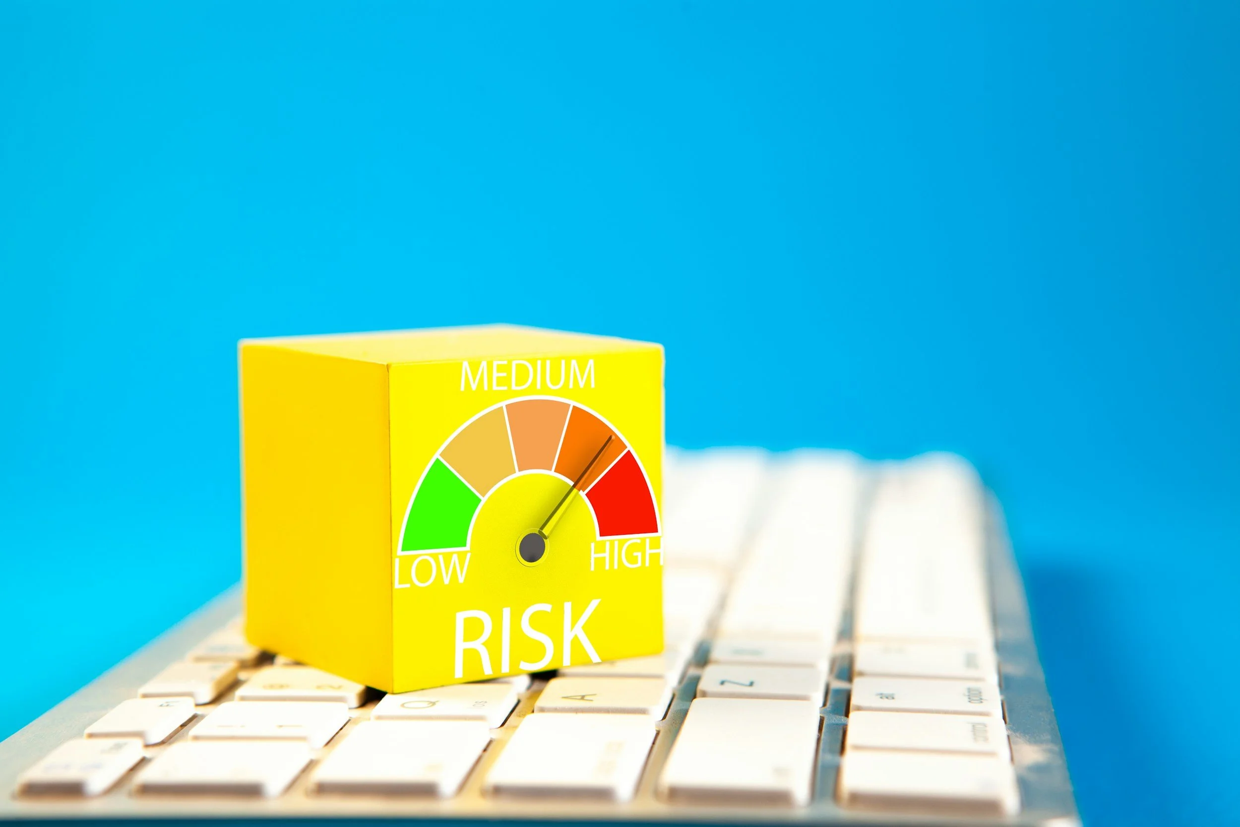 Yellow cube with risk graphic, pointing to high.  Lower anxiety and reactivity with tips and support from an anxiety counselor in College Park, Maryland.  In-person and online therapy appointments available.