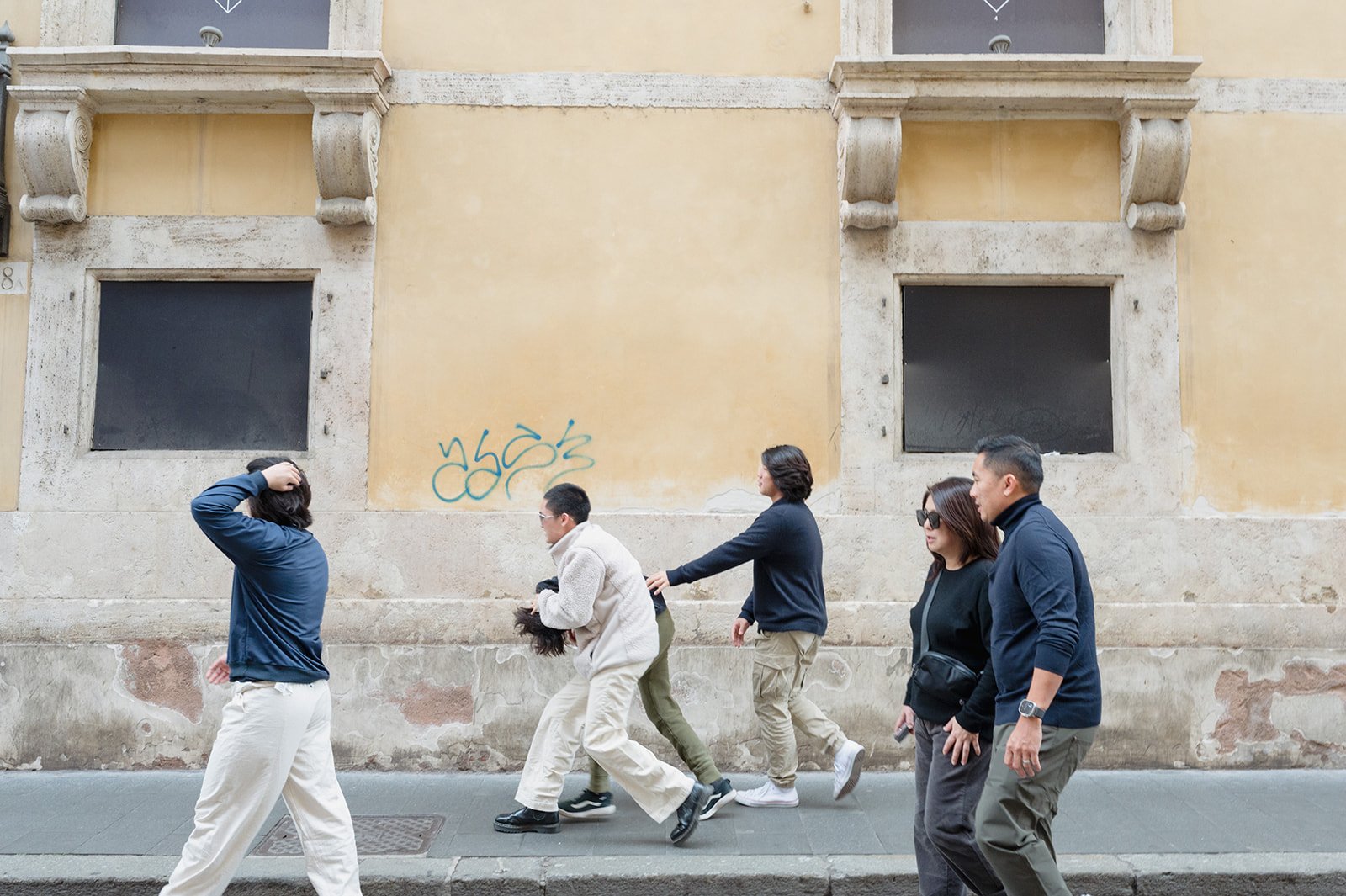 teeens fighting and playing with each other on the streets of Rome.jpg
