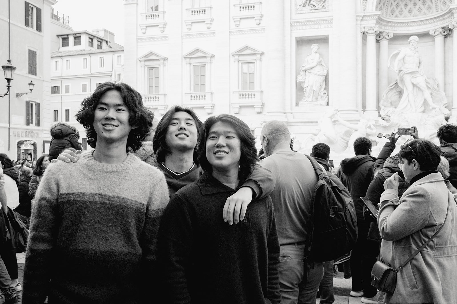 portrait of teenagers visiting rome, fontana di trevi.jpg