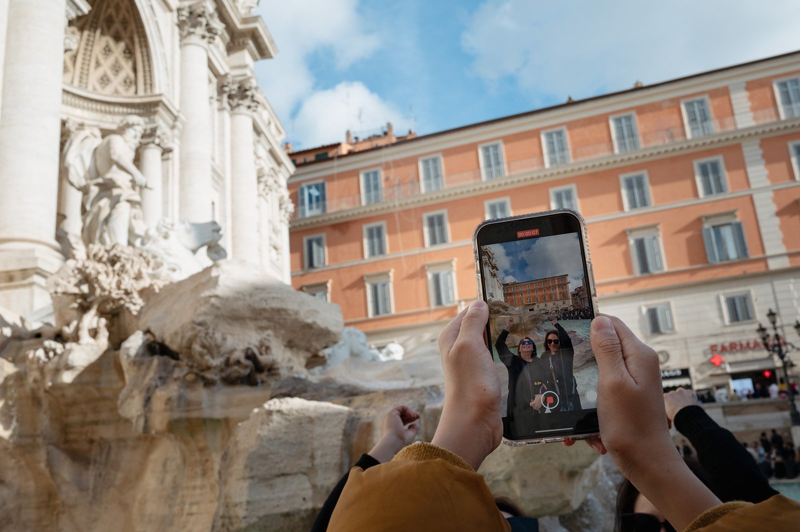 teen taking a photo of his mother in Rome.jpg