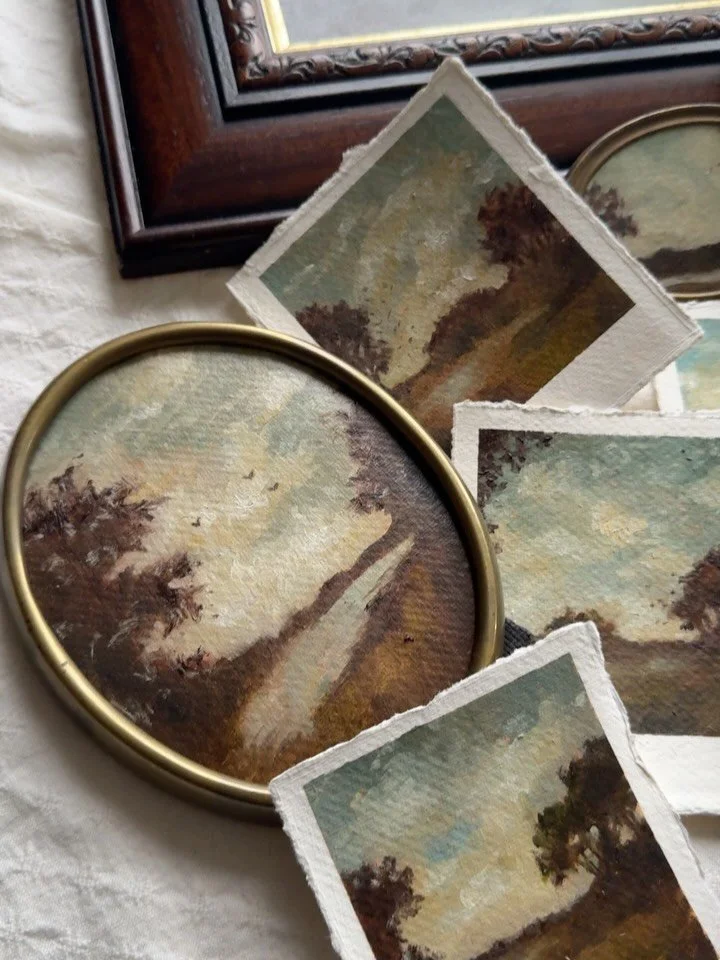 There is something quietly powerful about seeing them together.

Each small oil landscape in this collection began as a fleeting impression, a stretch of sky, a distant tree line, a path dissolving into shadow. Painted by hand on deckled paper, they 