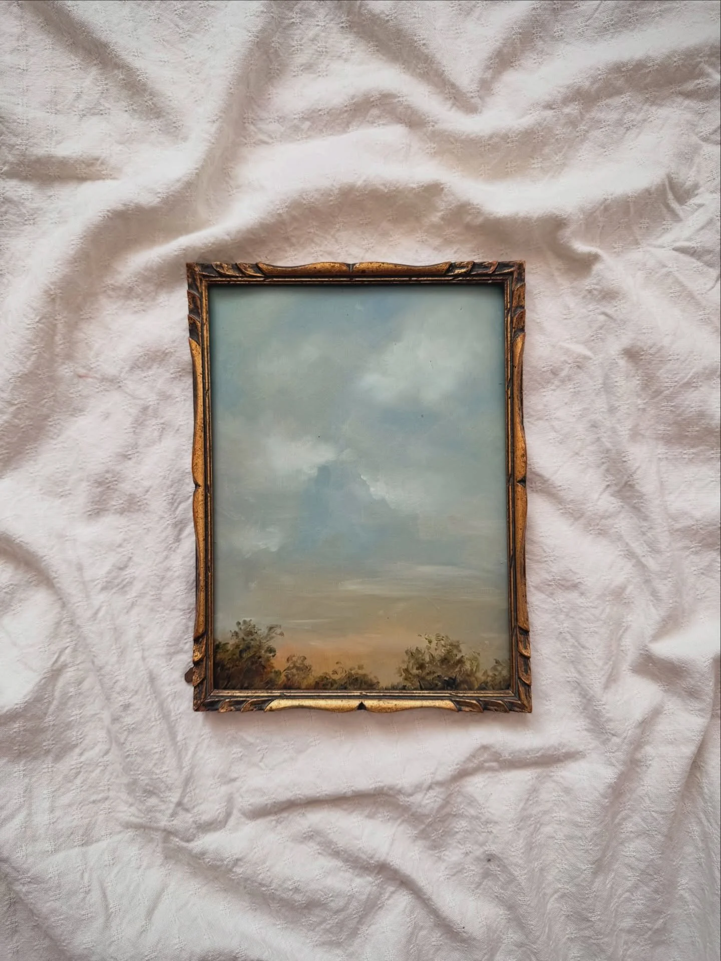 The First True Day

There&rsquo;s a sky that arrives at the beginning of summer.

wide, steady blue-grey that settles over everything.

After months of winter clouds, it feels almost unfamiliar.

The air is warmer.
The light stretches longer into the