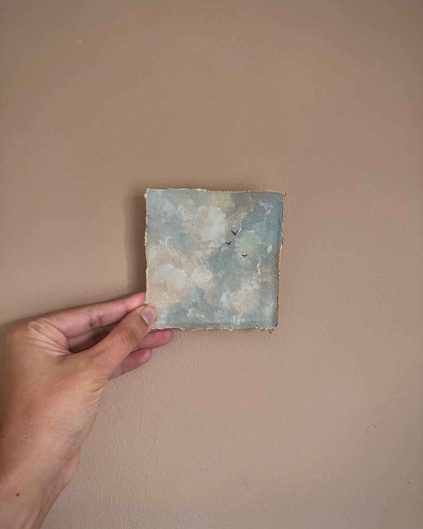 This original oil painted sky feels less like a backdrop
and more like a place things pass through. 

Clouds move across it.
Light drifts in and out of it.
Birds appear for a moment and then disappear somewhere beyond the horizon.

Nothing stays for 