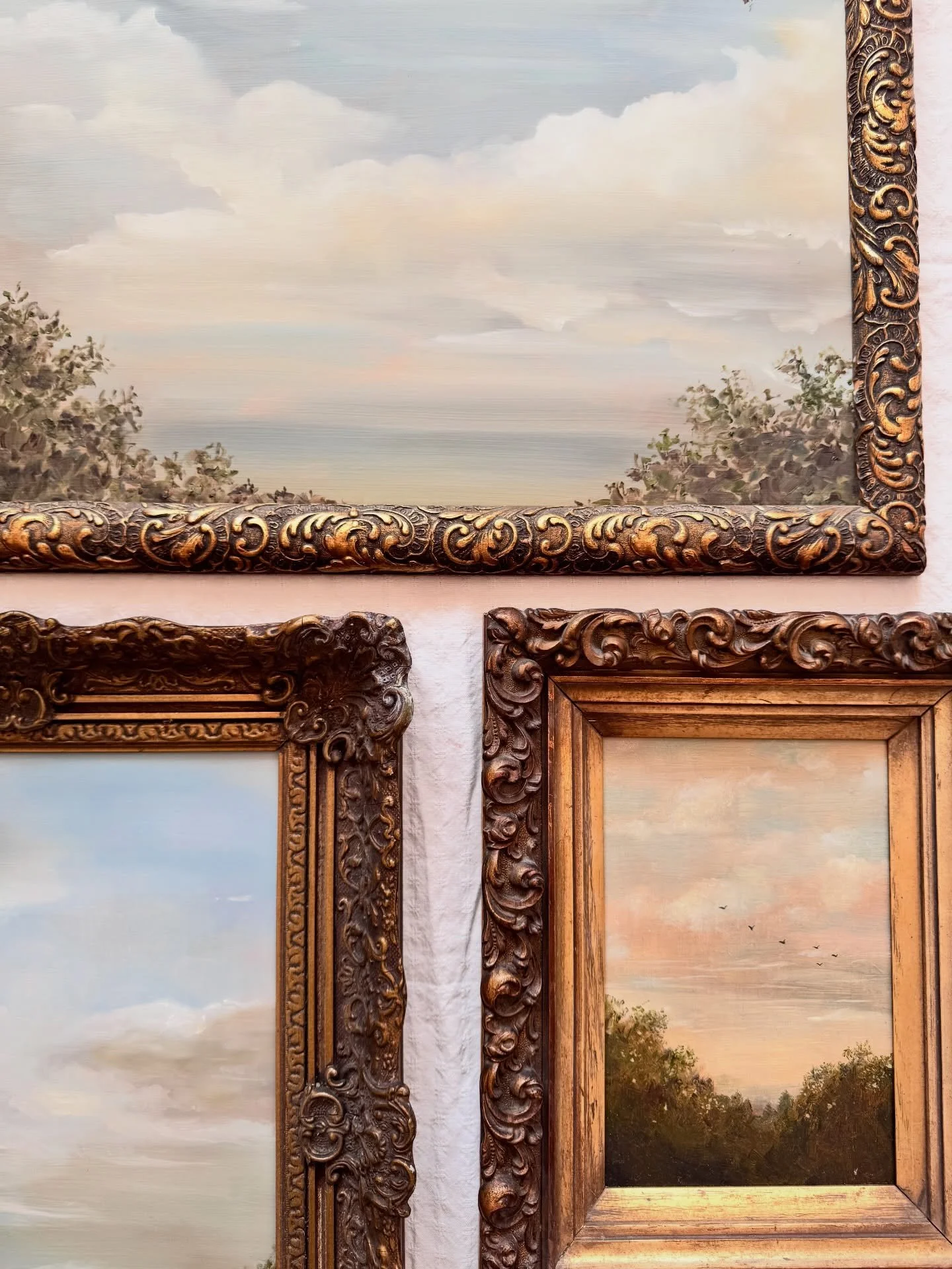 Some of the most important parts of this collection live in the details.

The skies are often blended with my fingers rather than a brush, softening the edges until the atmosphere feels less constructed and more like something passing through.

Along