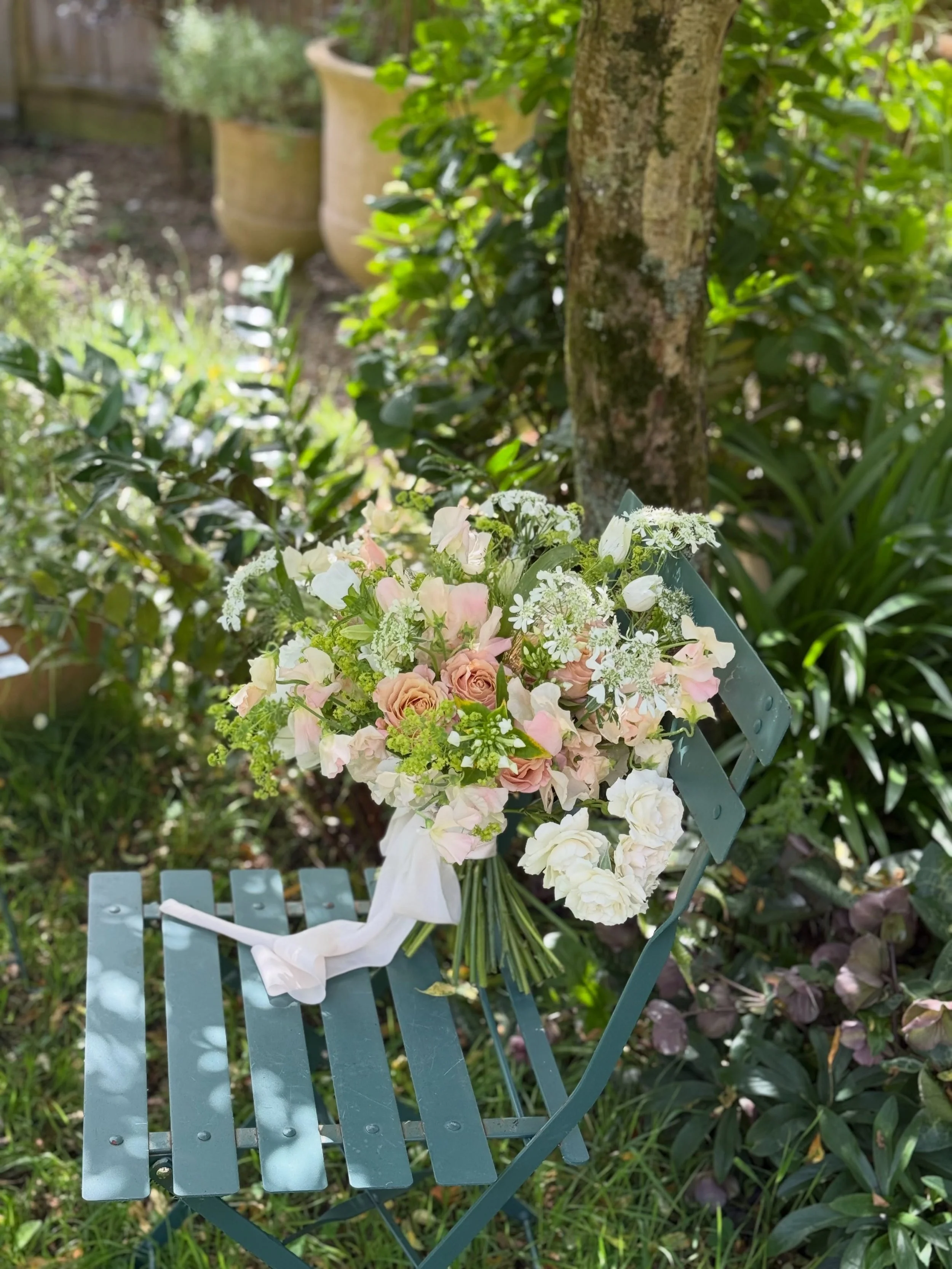 For Rachel and Harry. 

A hot May wedding day at Les Pres Manor over looking the water meadows. 

They chose a fresh white and peach palette with peonies, sweet peas, orlaya and alchemilla mollis making  everything light and frothy. 

We made a groun