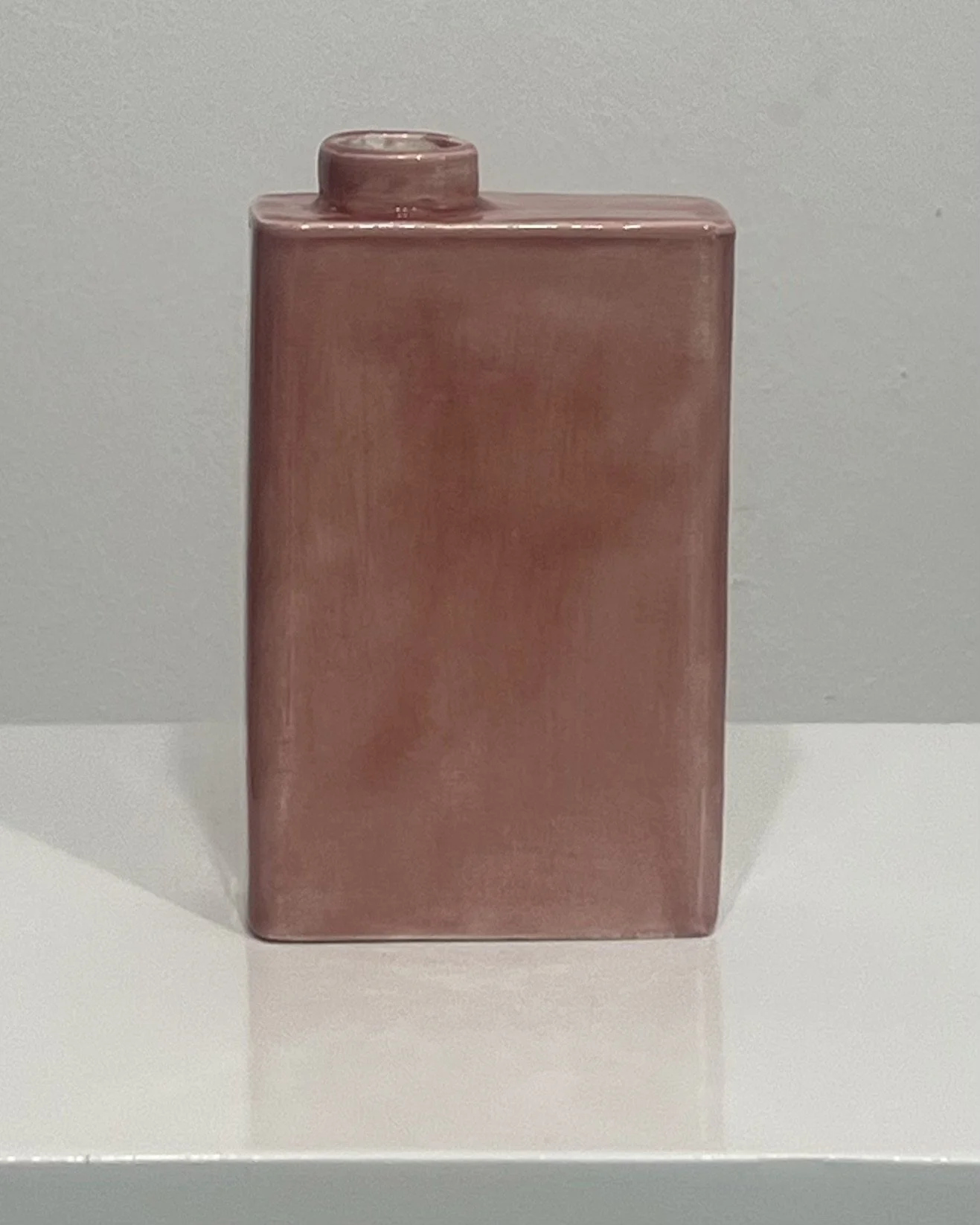 Front view of handmade porcelain carton vase C26.10 finished in Weeping Plum glaze with subtle pink and mauve variations.