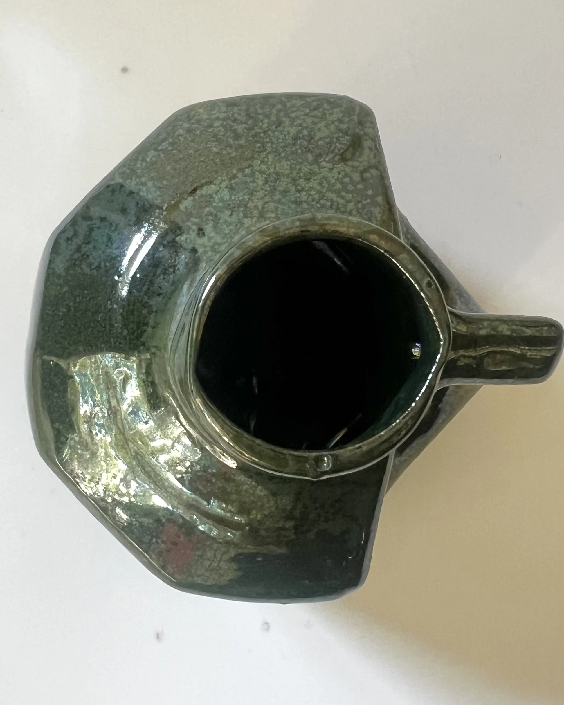 Top-down view of porcelain milk jug 26.48 showing the circular opening and interior.