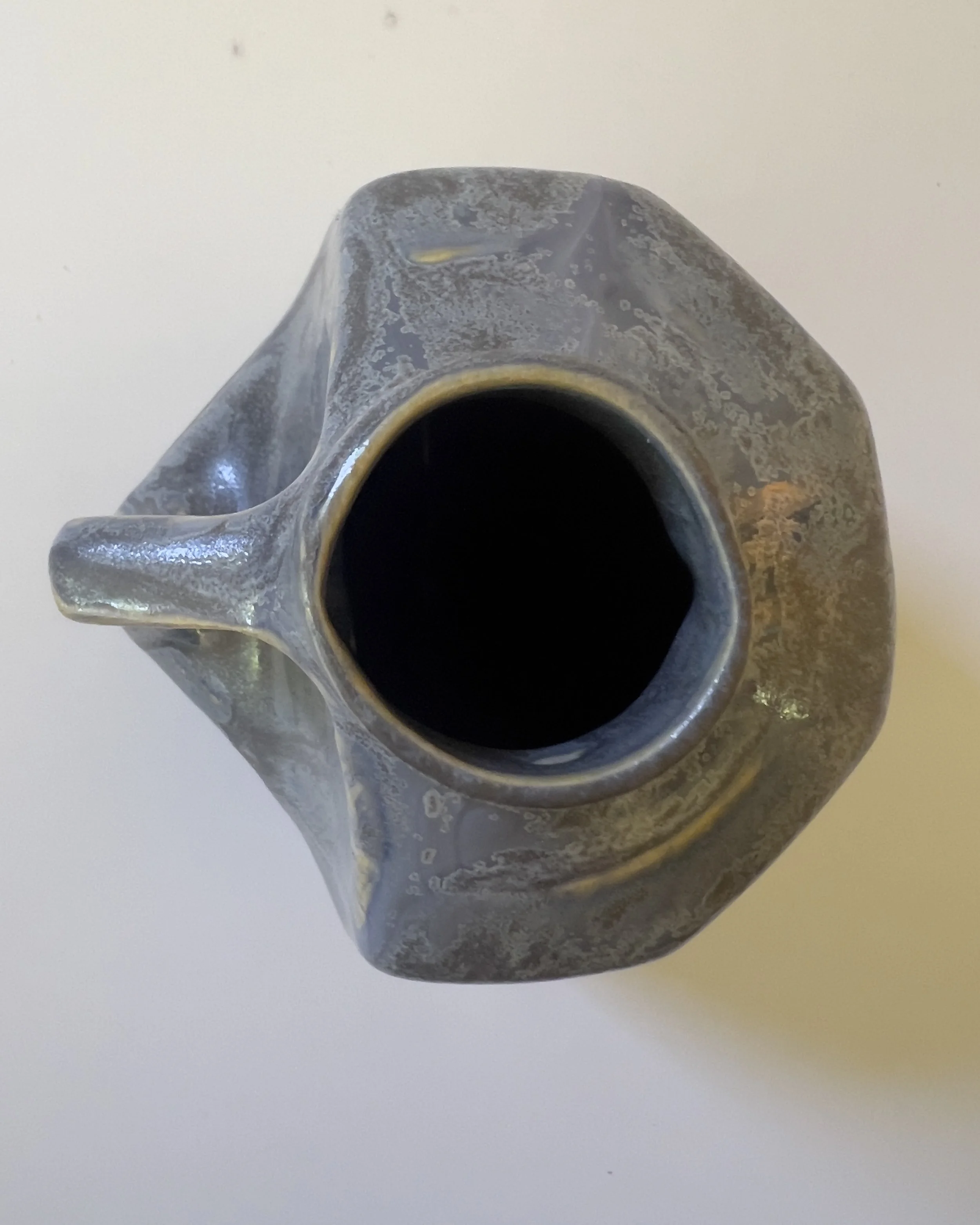 Top view of handmade ceramic milk jug vase showing opening and glaze detail